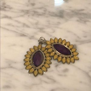 Yellow earrings with purple center